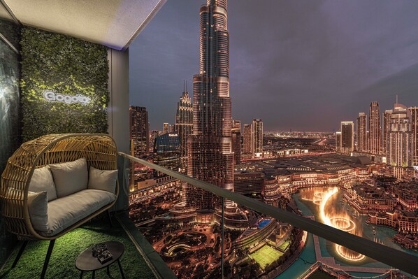 A beautiful balcony with stunning views of the Burj Khalifa and Dubai Fountain.