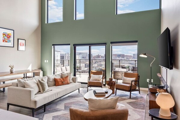 Bright and spacious living room off the kitchen. Smart TV, remote controlled room darkening shades, and pull-out sleeper sofa for ultimate comfort. Dining table that can seat 8 people.