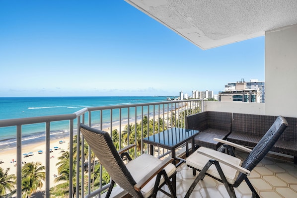 Enjoy your morning coffee on the private balcony with a charming table and stunning views!