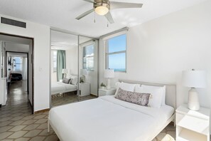 Charming bedroom with a cozy bed and full-length mirror—ideal for restful nights!