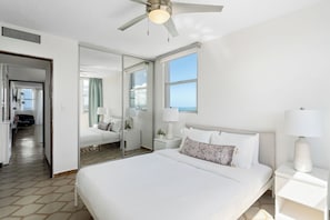 Charming bedroom with a cozy bed and full-length mirror—ideal for restful nights!