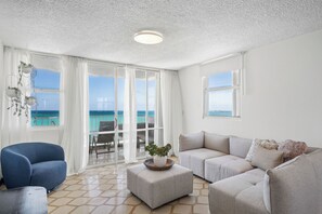 Bright and airy living room with a comfortable couch and large window—a great space to unwind!