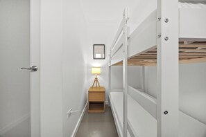 Sleep tight, times two! Bunk bed magic for this shared bedroom.
