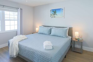Master bedroom with king bed and private bathroom