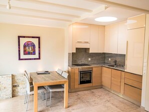 Furniture, Flooring, Interior Design, Floor, Wood, Kitchen, Countertop, Chair, Ceiling, Cabinetry