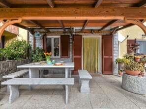 Wood, Furniture, Outdoor Furniture, Door, Shade, Outdoor Table, Flowerpot, Porch, Outdoor Structure, Houseplant