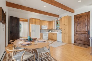 Open-concept and fully-equipped kitchen and dining area.