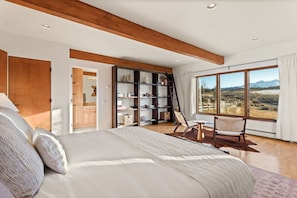 Professionally-designed primary bedroom with king-sized bed and views of stunning Mount Sopris.