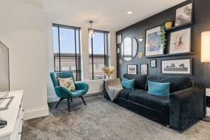 Living room with sofa bed and en-suite shower room.  TV with free access to Netflix. 
