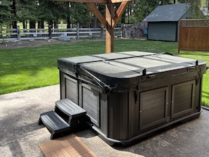 7-person saltwater hot tub on spacious back patio