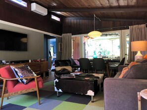 Open to the dining area and doors to the back deck.
