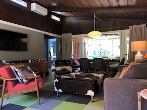 Open to the dining area and doors to the back deck.