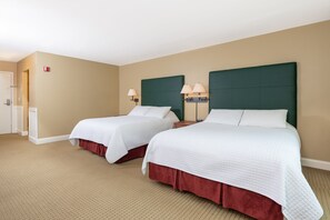 Comfortable sleeping arrangement in a roomy setting, perfect for families or groups seeking a restful stay.