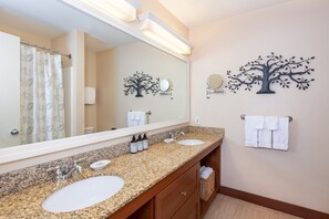 Start your day refreshed in this bright and spacious bathroom, where the airy design and thoughtful layout make getting ready feel like a breeze.