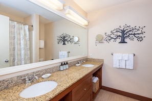 Refresh in this well-appointed bathroom, featuring a spacious vanity and a soothing ambiance for a calm start or end to your day.