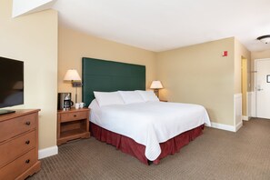 Peaceful bedroom with a warm and inviting ambiance, ideal for relaxation and rejuvenation during your stay.