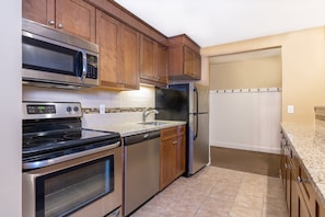 Well-equipped kitchen with modern appliances, ideal for preparing meals and enjoying home-cooked dining experiences.