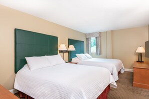 Tranquil bedroom with a calming ambiance and ample natural light, creating a serene atmosphere for rest.