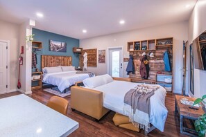 Cozy king-sized bed and a comfortable queen-sized pullout pictured.  The TV can be enjoyed from both.