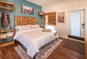 Cozy and comfortable king-sized bed with lots of hooks, hangers and clothing storage space.