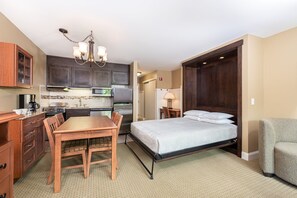 Comfortable sleeping and dining space combined in an open layout, offering a convenient and welcoming environment for relaxation.