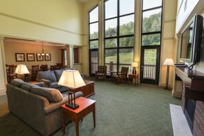Cozy and inviting lounge area, designed for comfort with plush seating and warm lighting.