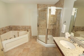 Spa-like bathroom oasis with a luxurious soaking tub and spacious walk-in shower for ultimate relaxation.