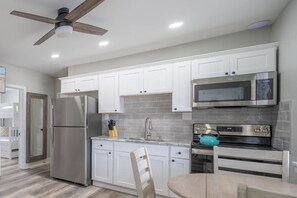 All functional kitchen appliances, cutlery and cookware available for your convenience.