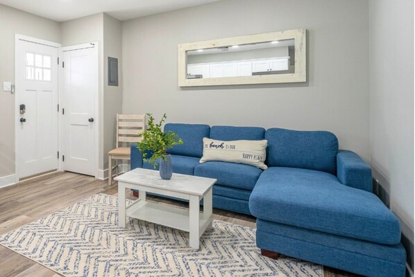Kick off your flip-flops and unwind in this coastal-inspired living space just steps from the beach.
