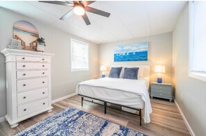 Wake up to sunlight and sea breezes in your serene bedroom.