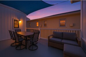 Your romantic beachside escape awaits—modern comfort and twilight skies just steps from the shore.