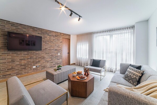 Living room with nice big 55" SmartTV.