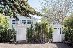 Beach Side Cottage Exterior Viewing from the parking lot. Upper Level entrance on the left, lower entrance gate on the right