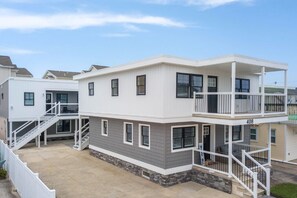 Crisp curb appeal and beach-town charm await your arrival.