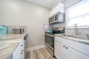 Pour a glass and start the evening in this fully equipped kitchen.