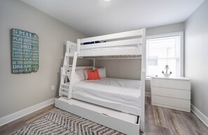Bunk Bed Retreat: Fun-filled nights in a vibrant room with playful decor and plenty of light!