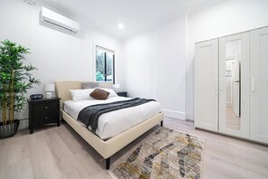 Unpack and organise your belongings in the wardrobe before sinking into the second bedroom’s queen bed.