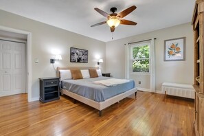 Master Bedroom with King Bed ceiling fan, natural light, and walk in closet