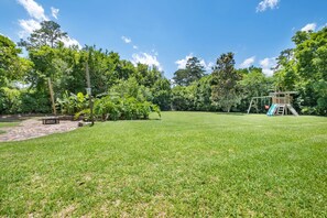 Expansive fenced backyard perfect for kids, pets, and tailgate fun