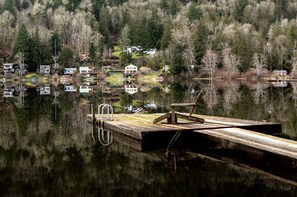Below the house is the lake access with a dock for swimming, fishing or relaxation