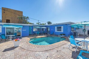 Imagine sunny afternoons lounging by this refreshing shared pool.