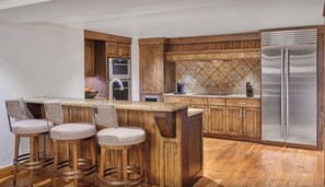 Full Chef's Kitchen with washing machine and dryer tucked away on the left