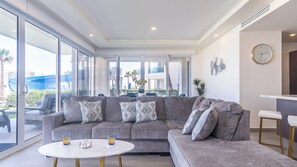 The living room with lots of windows looking out on the Resort grounds.