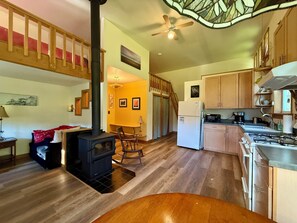 Open floor plan with Hang Out Nook to left, two sleeping lofts with ladders.
