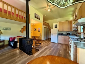 Open floor plan with Hang Out Nook to left, two sleeping lofts with ladders.