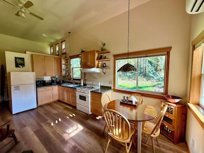 Full kitchen and dining area. High ceilings, lots of natural light.