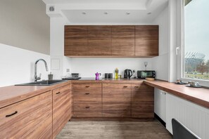Living Room with Kitchen & Stunning National Stadium View | Book Now with RENTUJEMY.COM