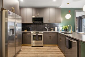 Kitchen equipped with everything you'd need to make a home cooked meal, Keurig coffee maker and complimentary pods