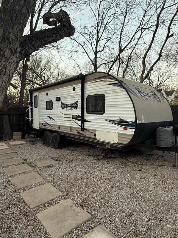 Trailer is in the back corner of the property. It's nice and private