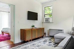 Living area with first floor bedroom in the background.
